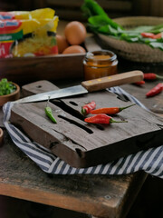 red chilies on a chopping board ready to processed for cooking dishes. Cooking preparation concept
