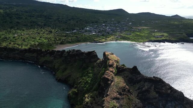 Coastal Aerial View Of Oceanfront Dragon's Back Volcanic Rock Formation, Comoros Islands, Drone Orbital View