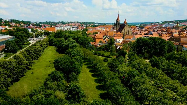 4K Aerial Drone Video of the St. Johannis Kirche Church, Kirche St. Gumbertus Church, and Br&uuml;cken-Center Ansbach Shopping Mall in Ansbach, Germany