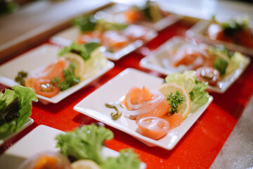 selective focus. Japanese sushi food. Sushi set plate served with ginger and soy sauce. Sushi rolls, salmon nigiri, shrimp nigiri, tuna nigiri