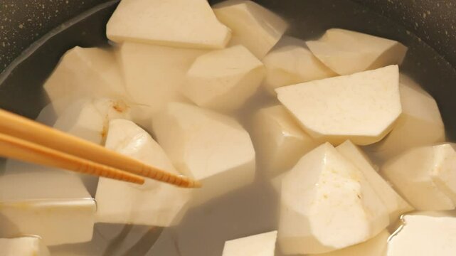 Taro being cooked, peeled and lye removed