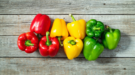 Fresh sweet bell pepper ( paprika ) photography red , green and yellow . Colorful vegetable . Top view