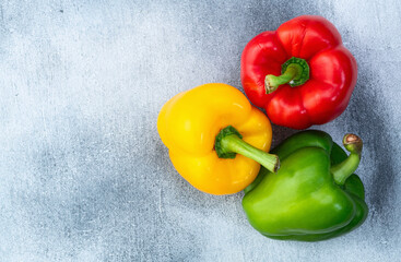 Fresh sweet bell pepper ( paprika ) photography red , green and yellow . Colorful vegetable . Top view