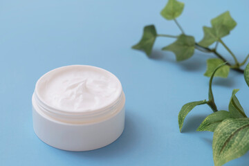 skin cream on the light blue background. Moisturizing cream, cosmetic cream, face cream, skin care,...