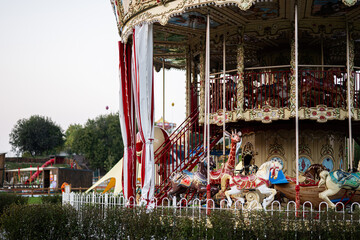 Vintage carousel in an amusement park during daytime