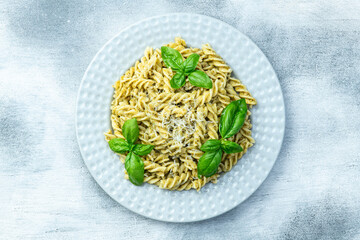 Pasta with basil sauce pesto . Italian food photography . Top view