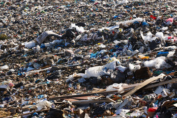 Open air garbage dump. Plastic waste pollution. Global warming. Consumerism