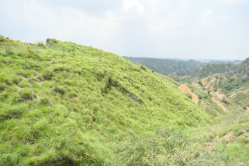 Obraz premium fantastic landscape scene with mountain, Mountain landscape, Rocks hills and brush fill the wilderness land, landscape scenery, beautiful big mountain views in chakwal, Panjab, Pakistan