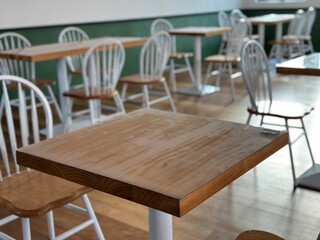 Close up of dining table and chair with defocused environment. Eating environment. 