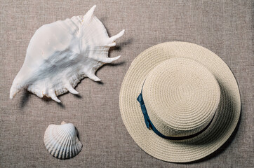 vacation flat view with straw hat and sea shellssea shells