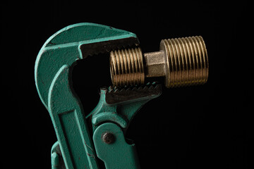 adjustable gas wrench on black background