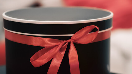 gift surprise box with red ribbon