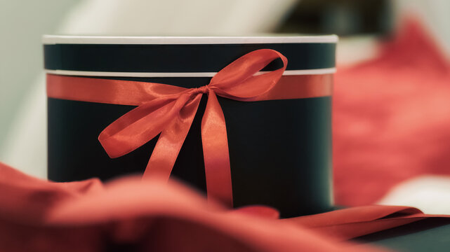gift surprise box with red ribbon