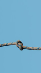 knot on a rope on a blue background