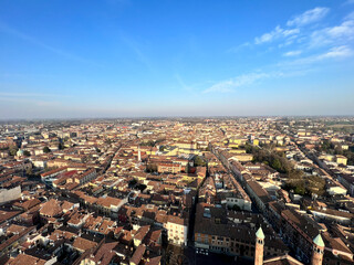 Fototapeta premium Cremona panorama of the cities seen from the Torrazzo tower at sunset. High quality photo