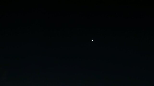 Timelapse of a Moon, Ultra-wide angle shot of night sky with clouds.
