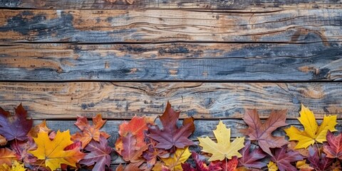 autumnal leaves on wooden background copy space