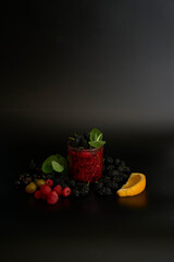 multivitamin smoothie with mulberry, raspberry, gooseberry, currant, mint, orange, gooseberry