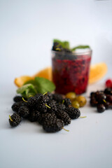 multivitamin smoothie with mulberry, raspberry, gooseberry, currant, mint, orange, gooseberry