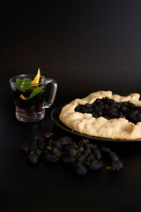 A galette pie with mulberry and  cold homemade mojito, soda with the mulberry