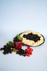 A galette pie with mulberry and  multivitamin smoothie with a mulberry, raspberry, gooseberry, currant, mint, orange, gooseberry
