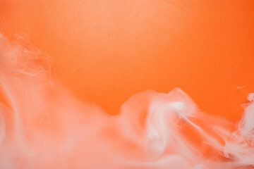 The orange background with white smoke or mist gives the impression of the spooky atmosphere of the scene. Halloween background concept