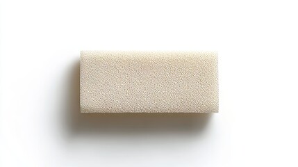 Fototapeta premium Top-down view of a rectangular adhesive bandage, smooth and clean, placed centrally on a white background with a gentle drop shadow for dimension