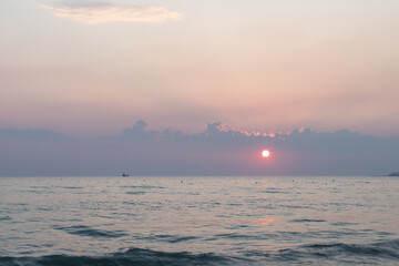 Sunset at beach over the Adriatic sea near the city of Dürres in Albania, which is a port city in western Albania, west of the capital, Tirana and known for its huge Roman amphitheatre