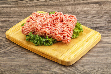 Raw pork minced meat over board