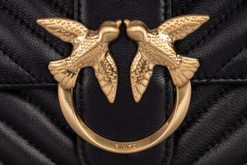 Poznan, Poland. 7 November, 2021. Close up of Pinko leather bag with signature gold bird buckle.