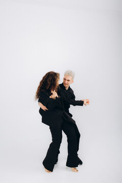beauty couple dancing social danse kizomba or bachata or semba or taraxia , on light grey background