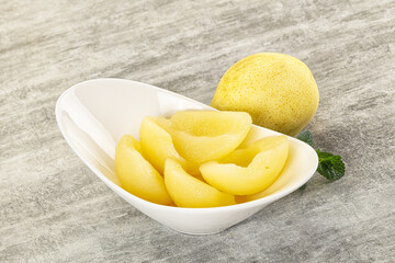 Canned yellow pear with syrup