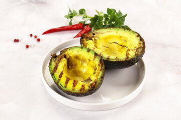 Sliced fresh avocado on the grill