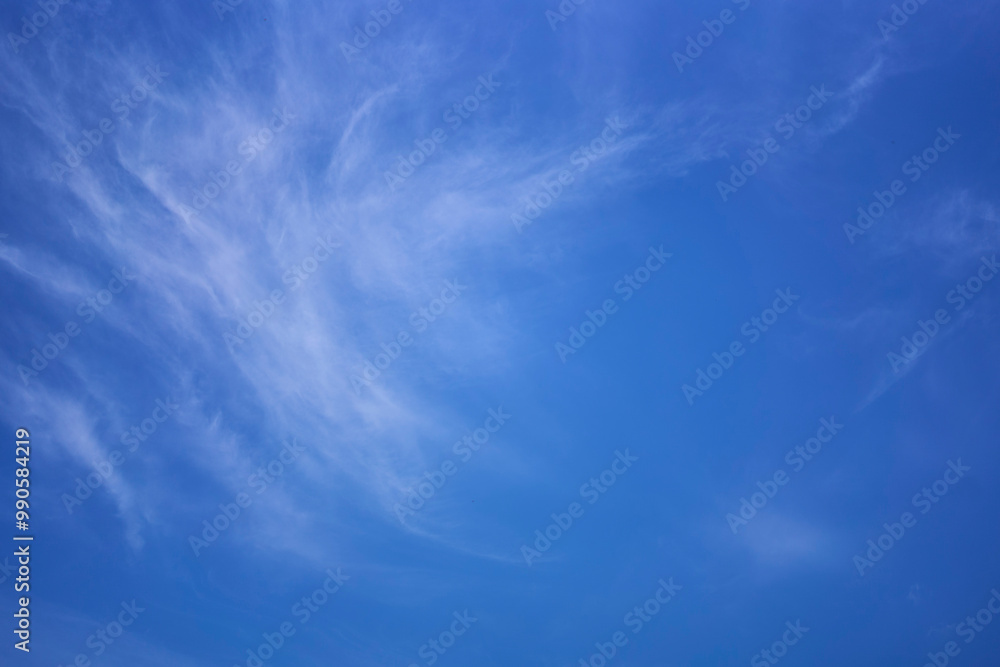 Wall mural the sky on a summer day with white cirrus clouds