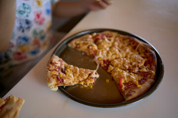 a workshop for children on cooking pizza in an old wood-fired oven