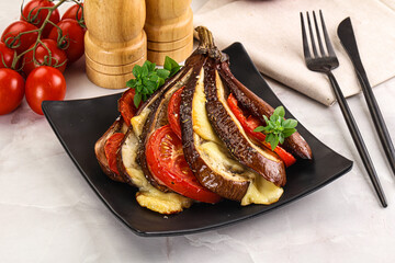 Baked tomato with mozzarella and tomato