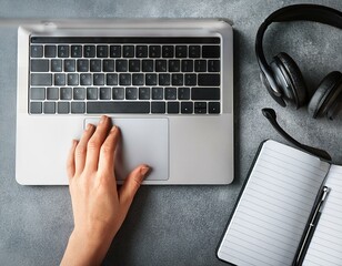 Female hands working on wooden work place with modern gadgets 