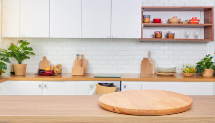 Empty round wood tabletop counter in bright kitchen ready for product montage
