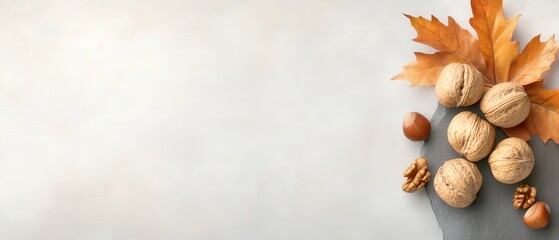 A white background with nuts and a leaf