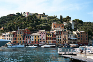 the bay, the boats and houses of Portofino by the sea and on the hill
