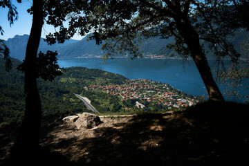 view through the trees to the shores of Lake Como