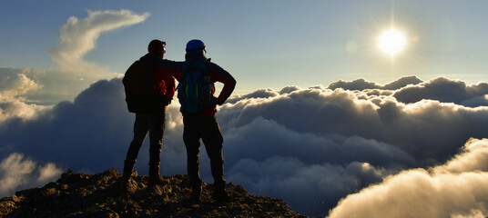 Two Friends at the Summit Watching the View