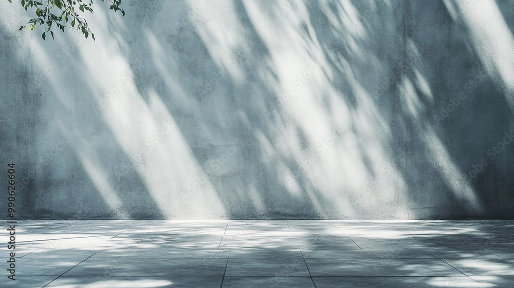 Aufkleber soft sunlight creating natural patterns on a textured wall and tiled ground in an outdoor setting