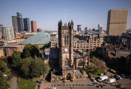 MANCHESTER, UK - SEPTEMBER 22, 2024: Drone aerial view of Manchester Cathedral and city centre skyline