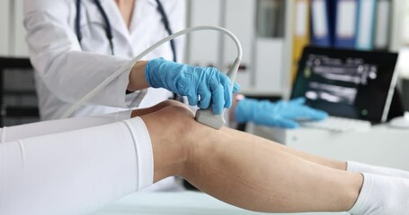 Woman leg ultrasound diagnosis, close-up, slowmotion. Scanning of vessels and veins, medical equipment