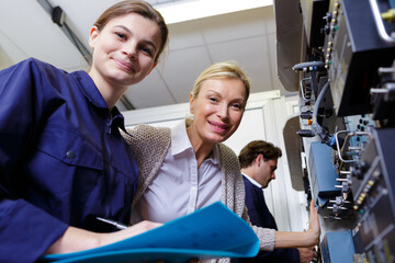 female aviation engineers posing and smiling