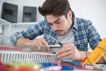 a man is fixing radiator