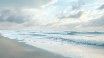 Winter beach scene with gentle waves under soft skies and a calm atmosphere showing nature's beauty in muted tones of sand and sea