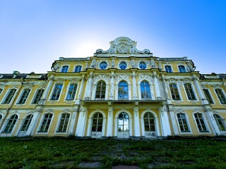The facade of an abandoned Baroque estate in Peterhof, Russia, with its once-glorious architecture...