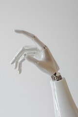 Robot hand posed as if delicately holding something.
